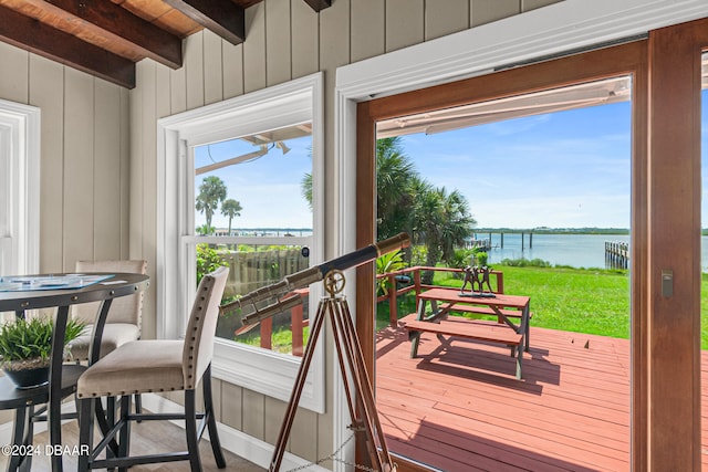 interior space with a deck with water view