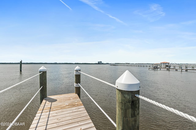 view of dock with a water view