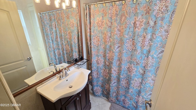 full bathroom with tile patterned floors, curtained shower, and vanity