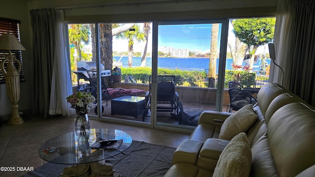 tiled living area with a water view