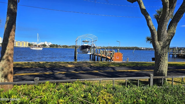 dock area with a water view and boat lift