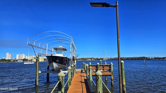 view of dock featuring a water view and boat lift