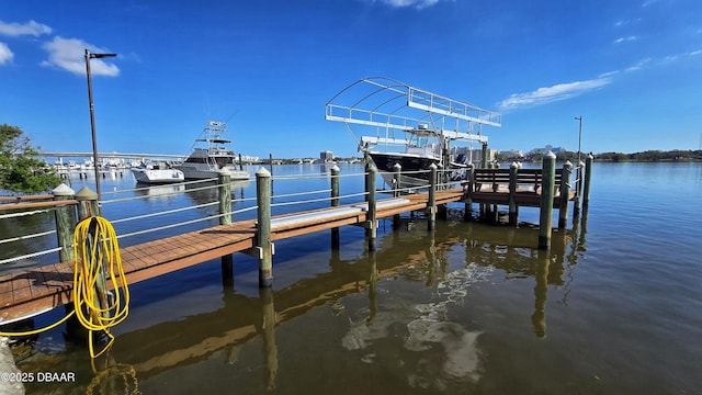 view of dock featuring a water view and boat lift