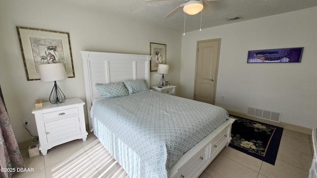 bedroom featuring light tile patterned floors, visible vents, and baseboards