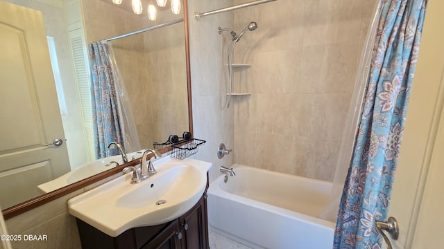 full bath featuring vanity and shower / bath combo