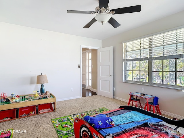 carpeted bedroom featuring ceiling fan