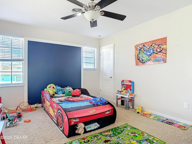 carpeted bedroom with ceiling fan