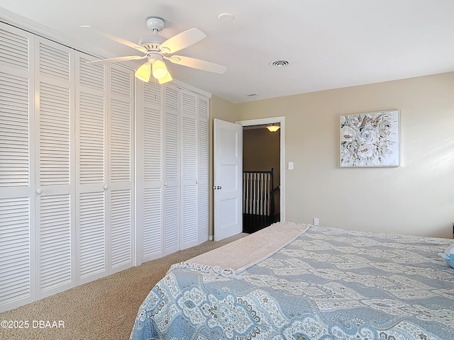 carpeted bedroom featuring ceiling fan