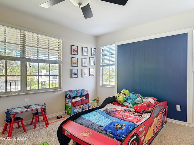 carpeted bedroom featuring ceiling fan