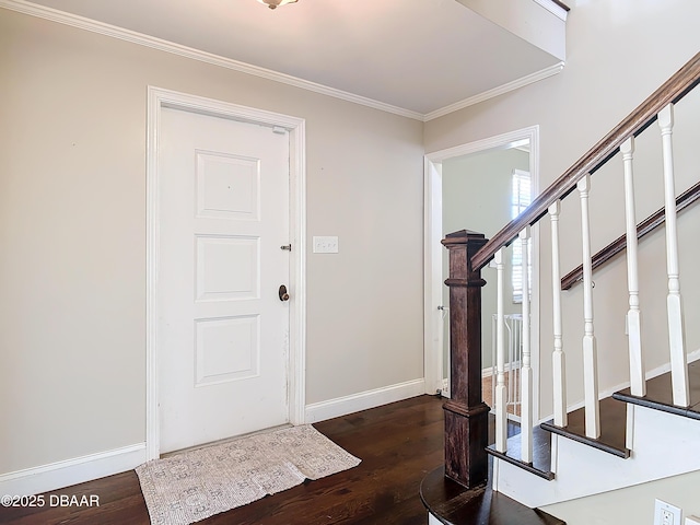 entryway featuring ornamental molding and dark hardwood / wood-style floors