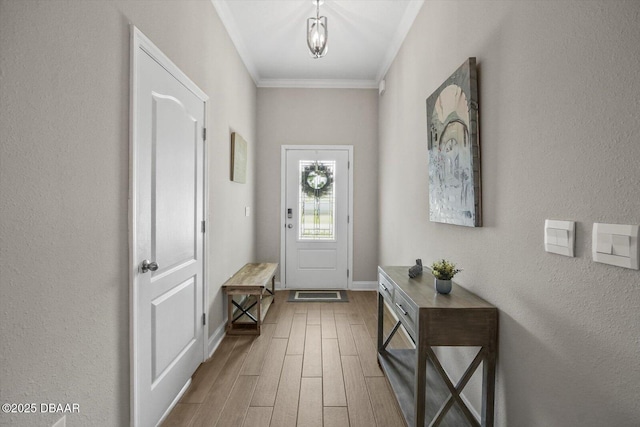 52 Lumber Jack Trl, Palm Coast, FL 32137 - entryway with wood finished floors, crown molding, and baseboards