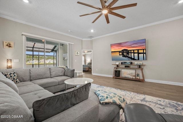 52 Lumber Jack Trl, Palm Coast, FL 32137 - living room with ceiling fan, wood finished floors, ornamental molding, recessed lighting, and baseboards