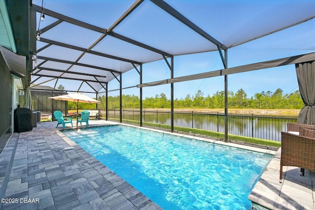 52 Lumber Jack Trl, Palm Coast, FL 32137 - view of pool featuring a water view, a patio area, glass enclosure, and view of wooded area