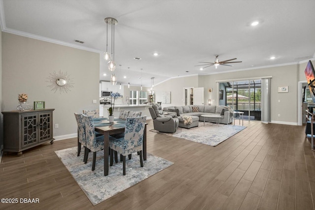 52 Lumber Jack Trl, Palm Coast, FL 32137 - dining room with ceiling fan, crown molding, dark wood-style floors, baseboards, and recessed lighting