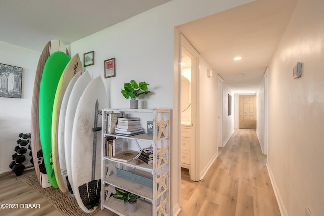 hallway with light hardwood / wood-style flooring