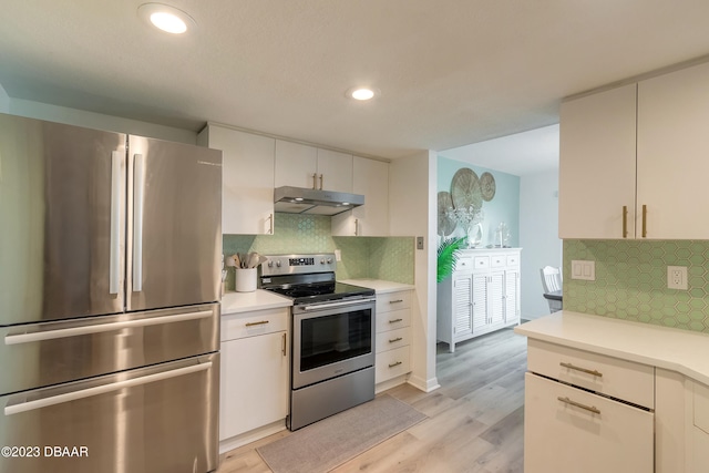 kitchen featuring tasteful backsplash, light wood-type flooring, white cabinets, and stainless steel appliances