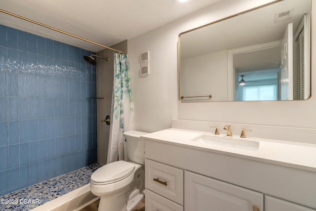 bathroom with walk in shower, vanity, and toilet