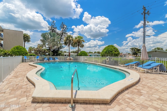 view of swimming pool with a patio