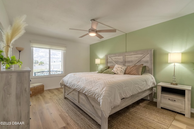 bedroom featuring ceiling fan and light wood-type flooring