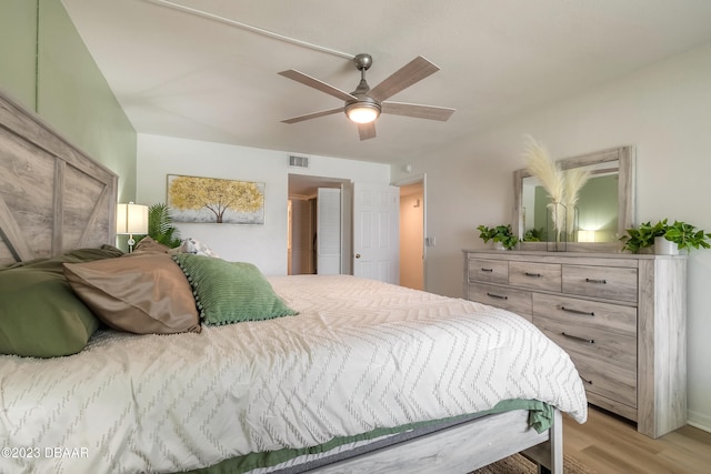 bedroom with ceiling fan and light hardwood / wood-style flooring