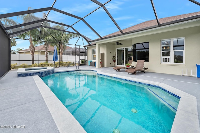 view of pool featuring an in ground hot tub, glass enclosure, and a patio area