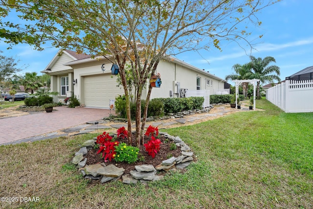 exterior space featuring a garage and a yard