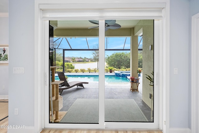 doorway to outside with ceiling fan