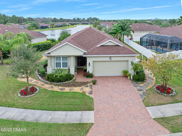 view of front of home with a water view, a front lawn, a lanai, and a garage