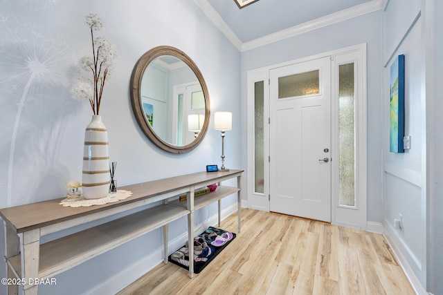 foyer entrance with light hardwood / wood-style flooring and ornamental molding