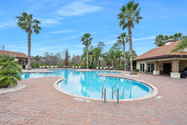 view of pool featuring a patio