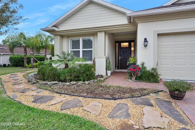 view of exterior entry featuring a garage