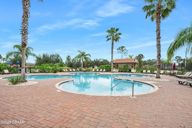 view of swimming pool with a patio area and a gazebo