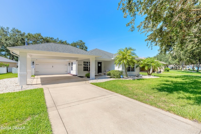 view of front facade with a garage and a front yard