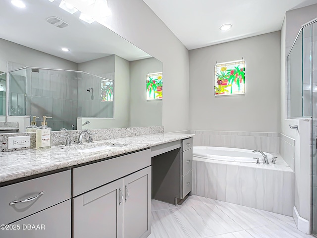 bathroom with vanity and plus walk in shower