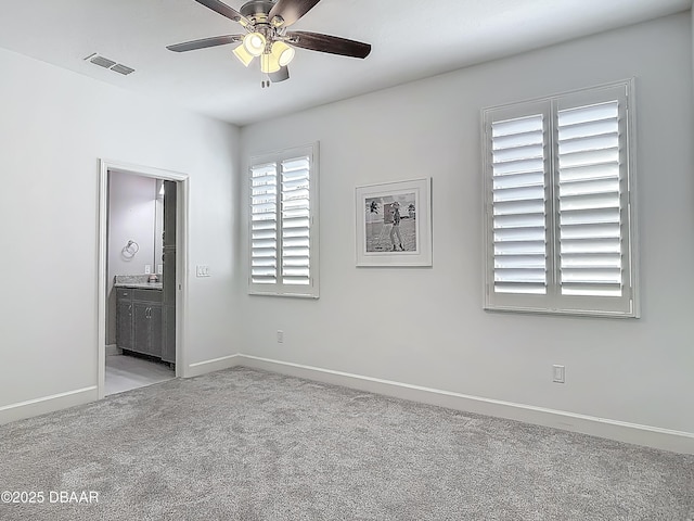 182 Island Breeze Ave, Daytona Beach, FL 32124 - unfurnished bedroom with carpet, baseboards, ensuite bathroom, and ceiling fan