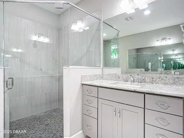 bathroom with vanity and walk in shower