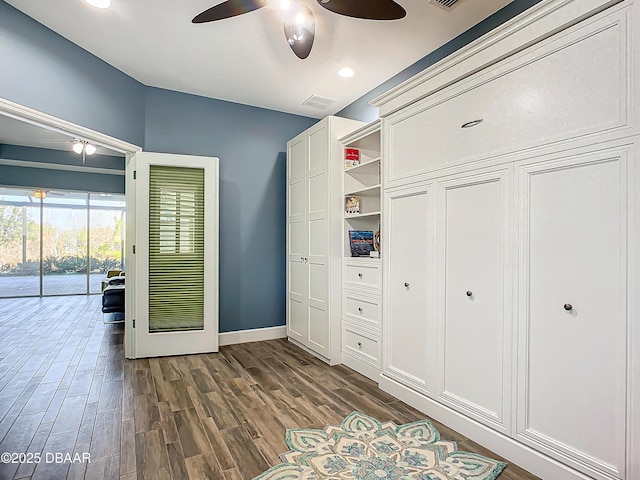 interior space featuring access to outside, ceiling fan, and dark hardwood / wood-style floors