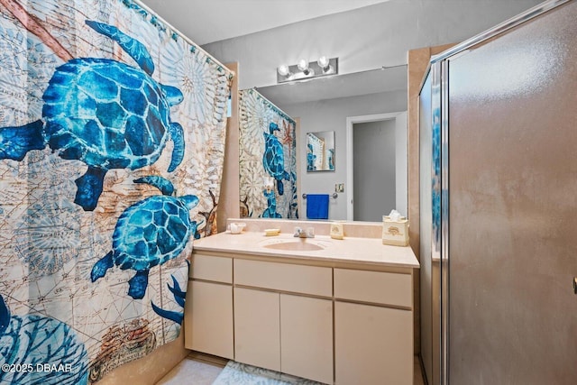 bathroom with a shower and vanity