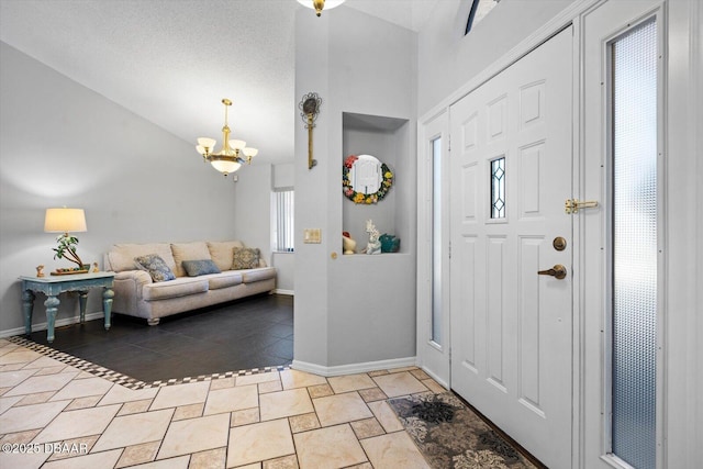 foyer featuring lofted ceiling and an inviting chandelier