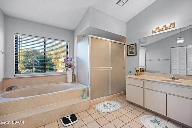 bathroom featuring tile patterned floors, a textured ceiling, vaulted ceiling, vanity, and independent shower and bath