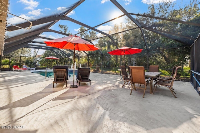 view of patio featuring glass enclosure