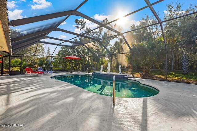 view of pool with a lanai and a patio