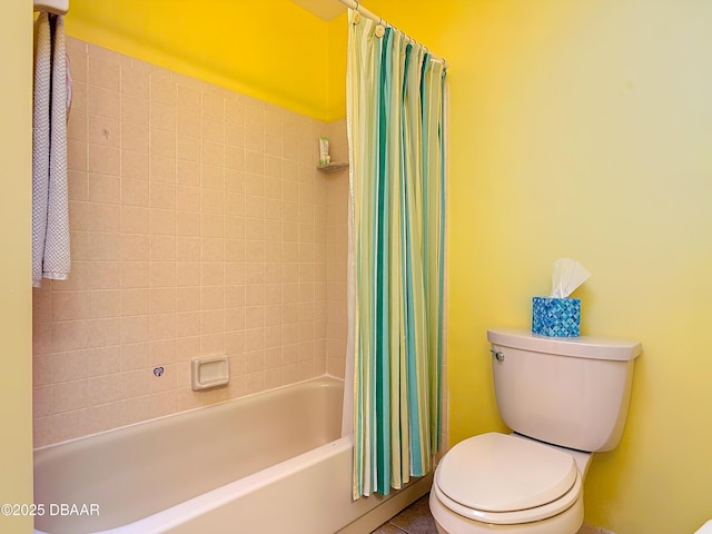 bathroom featuring toilet and shower / tub combo with curtain