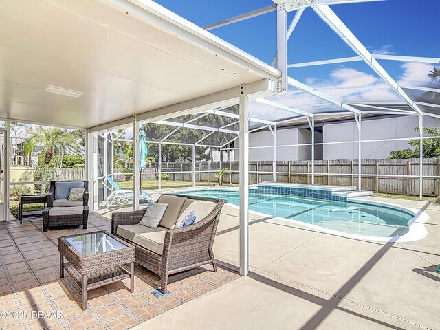 view of pool featuring a fenced backyard, outdoor lounge area, a fenced in pool, a lanai, and a patio area