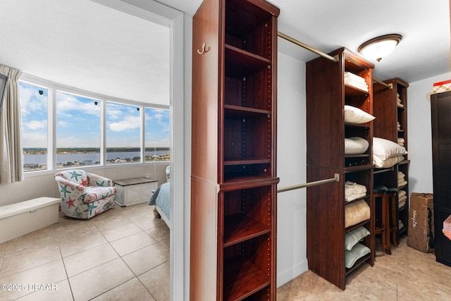 2625 S Atlantic Ave Unit 18Nw, Daytona Beach Shores, FL 32118 - spacious closet featuring light tile patterned flooring