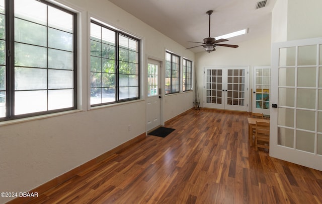 spare room with dark hardwood / wood-style flooring, ceiling fan, and french doors