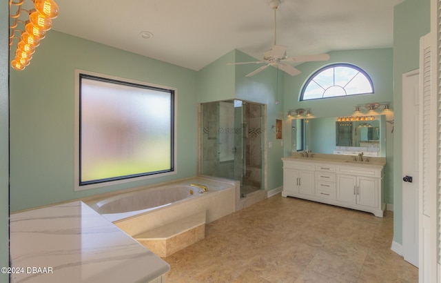 bathroom featuring vanity, separate shower and tub, and ceiling fan