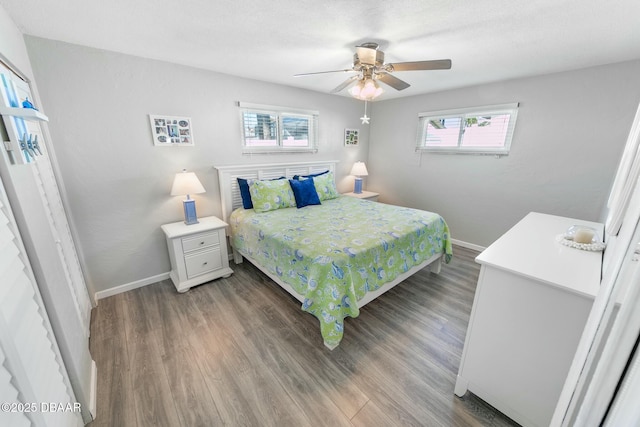 bedroom featuring ceiling fan and dark wood-type flooring