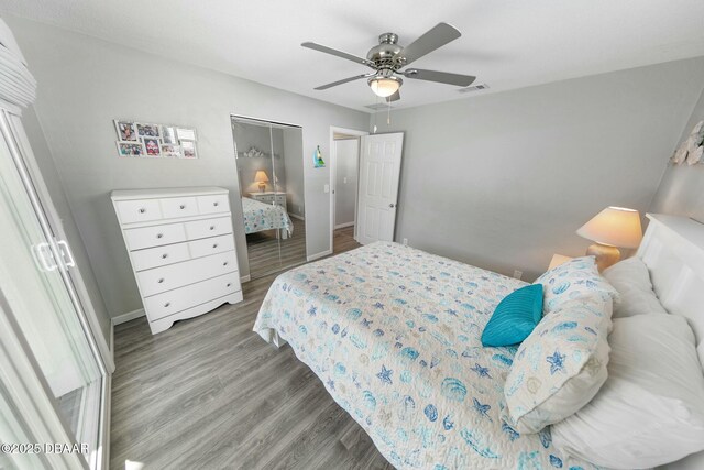 bedroom with hardwood / wood-style flooring, ceiling fan, and a closet