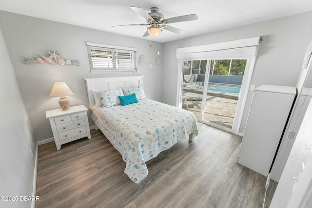 bedroom featuring hardwood / wood-style flooring, ceiling fan, and access to outside